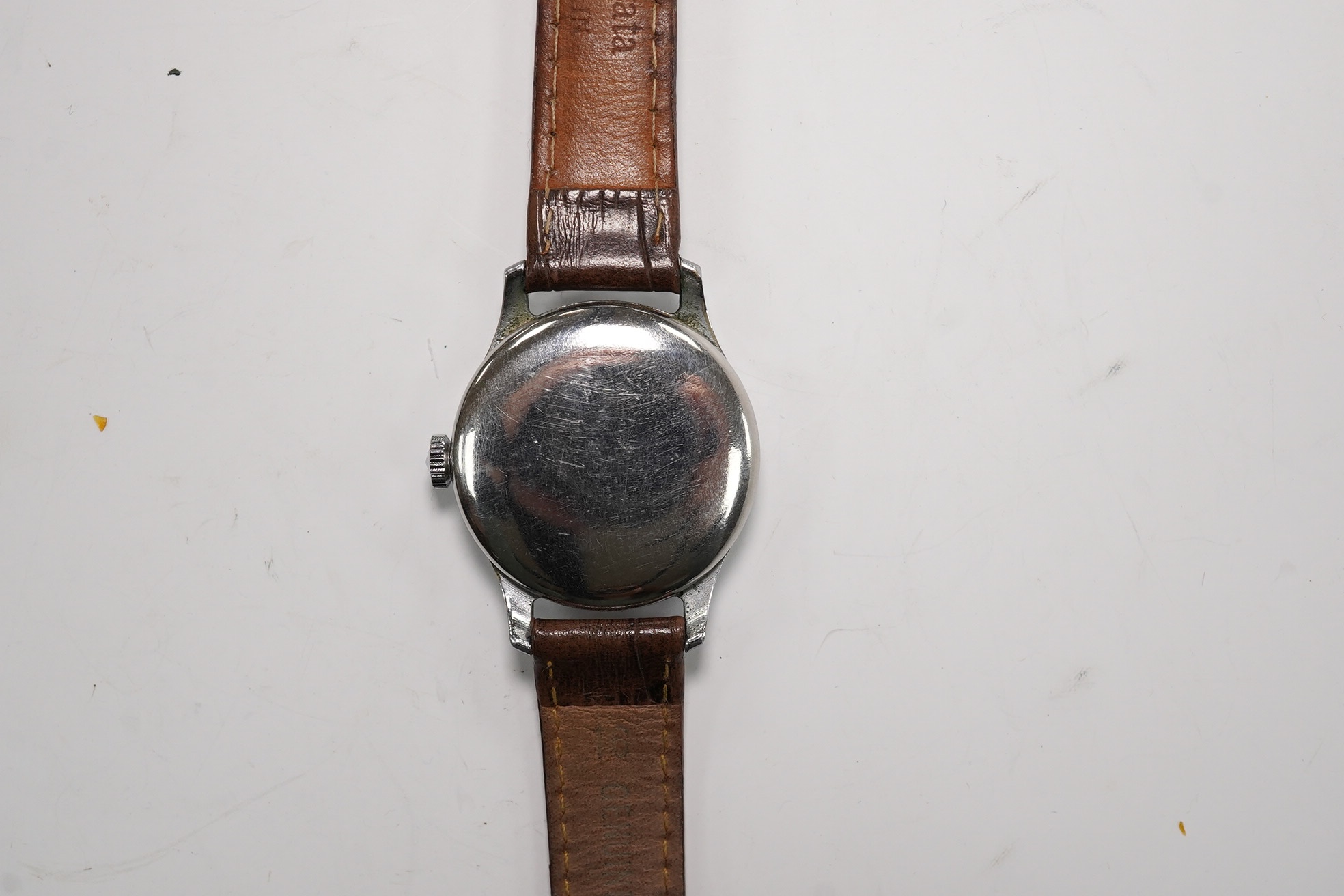 A gentleman's steel Russian manual wind wrist watch, the dial inscribed Kupoba, with Arabic dial, case diameter 34mm. Condition - poor